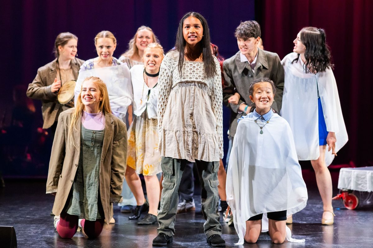 Young people in a British Youth Music Theatre production
