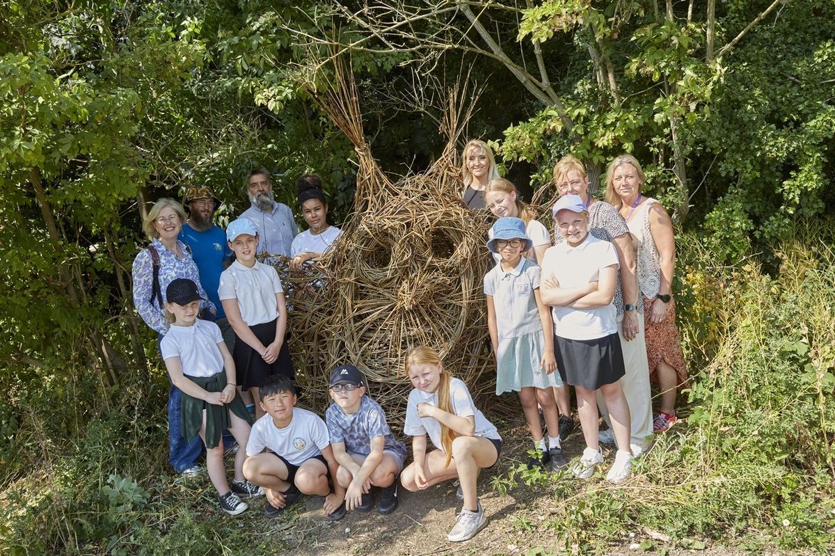 Back row, from left, Wykeland community engagement consultant Elaine Burke, artist Louis Dorton, Wykeland project manager Tom Cannon and Wykeland head of marketing Natalia Rudd, with staff and pupils from All Saints' CE Junior Academy on the woodland trail
