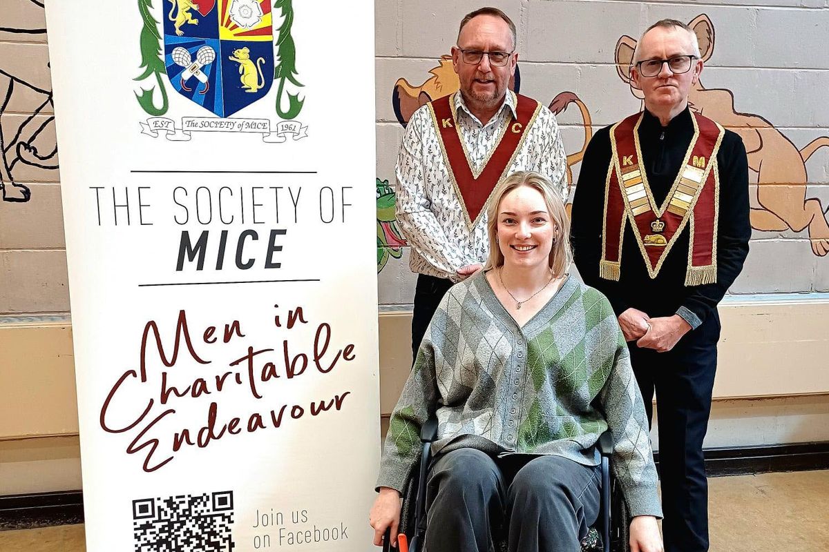 Harriet Lazenby with Mark Kelly and John Lazenby from Men In Charitable Endeavour and her new wheelchair