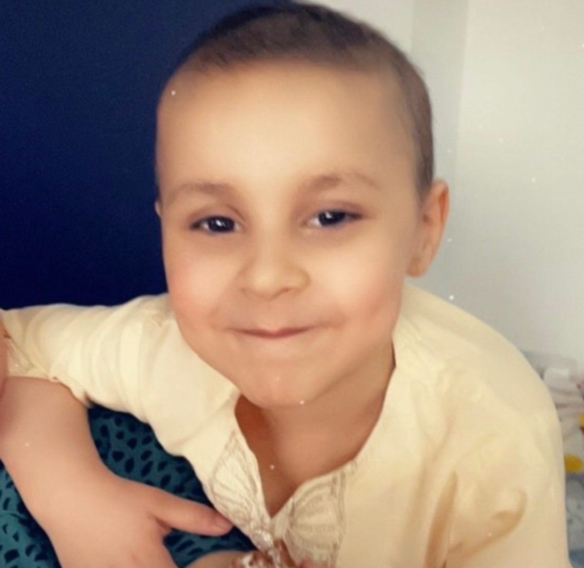 Aalia smiles at the camera