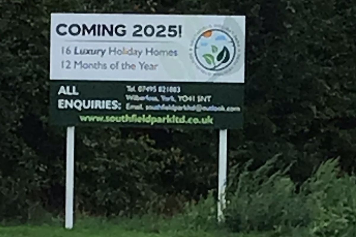 One of the illegal signs placed on a verge of the A1079 road at Wilberfoss by Southfield Holiday Park Ltd.