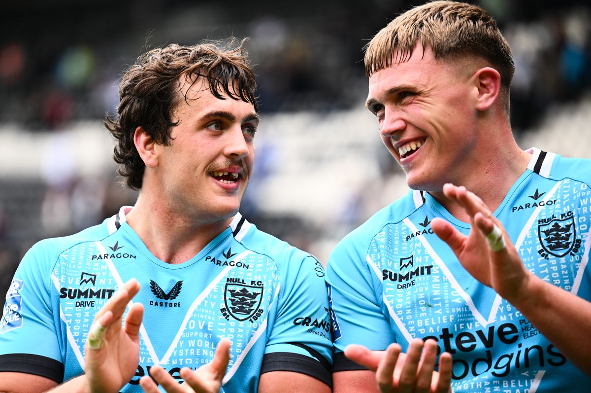 Hull FC forwards Max Wood and Harvie Hill celebrate victory over Huddersfield.