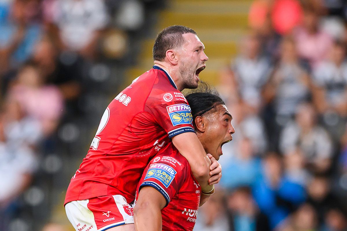 Hull KR's Tom Amone celebrates his try against Hull FC with James Batchelor..