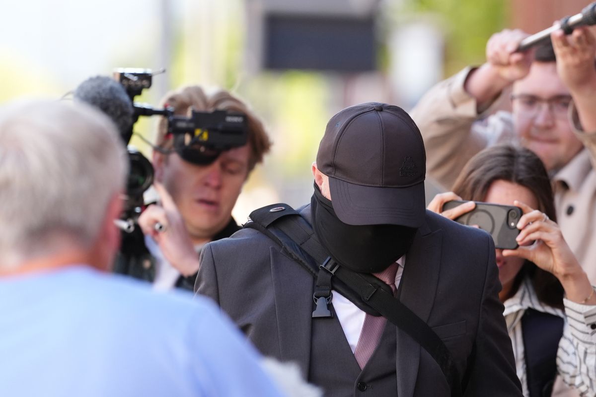 Funeral director Robert Bush (centre) arrives at Hull Crown Court for sentencing after human remains were found at his premises