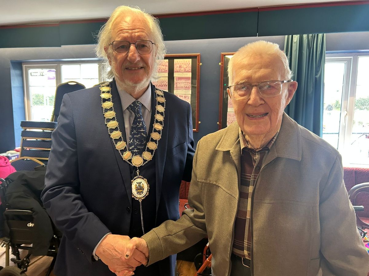 Peter is congratulated by Pocklington town mayor Cllr Roly Cronshaw on his 100th birthday