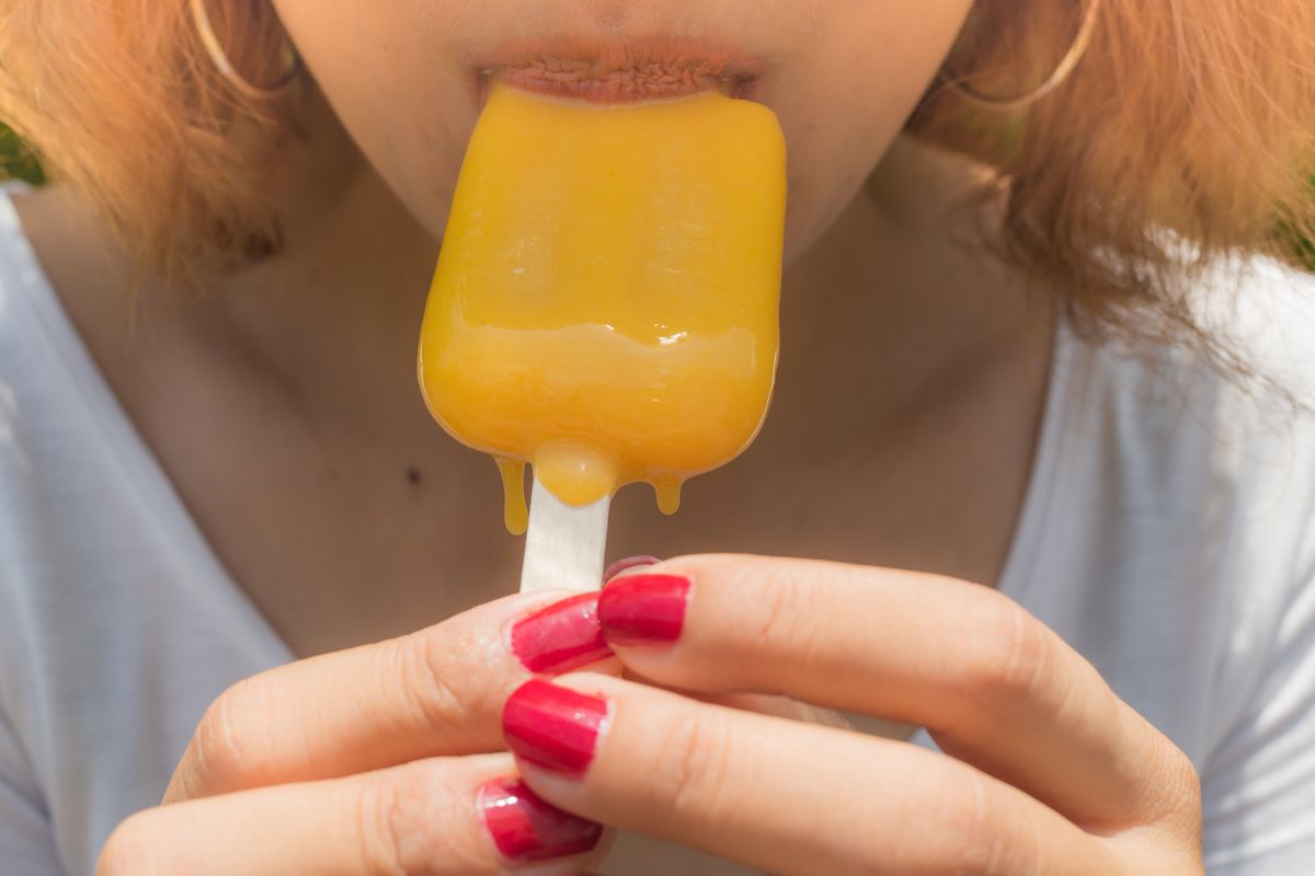 Woman eating a lolly