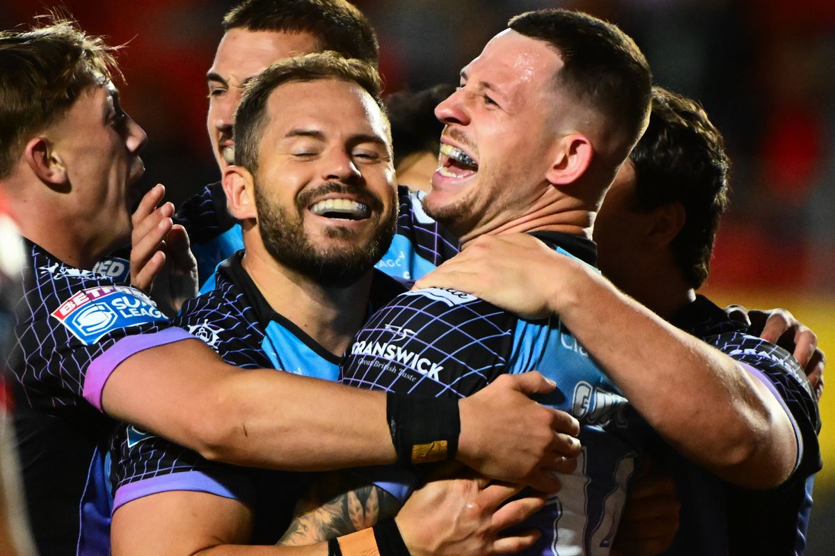 Hull FC captain Aidan Sezer celebrates Cade Cust's try.