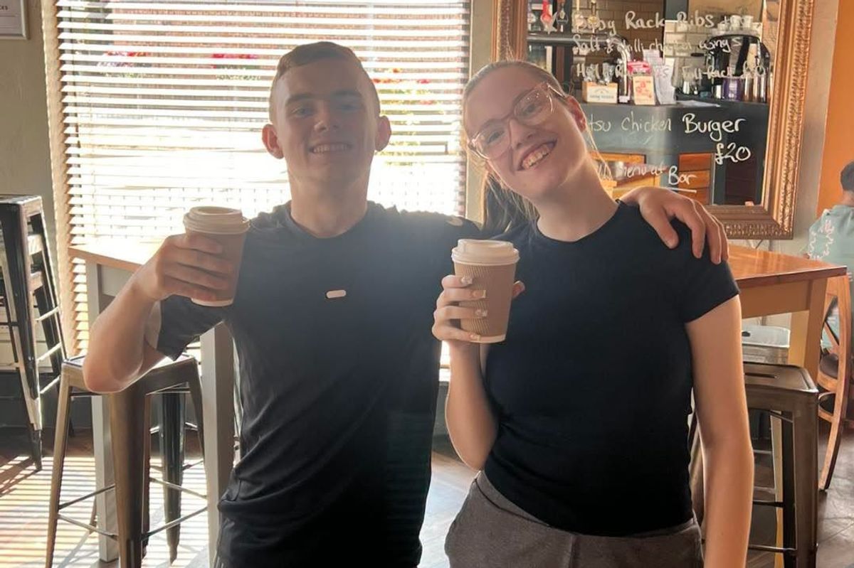 Two customers who saw a sign in Sleepers Bar and Kitchen's window and claimed their free hot drink