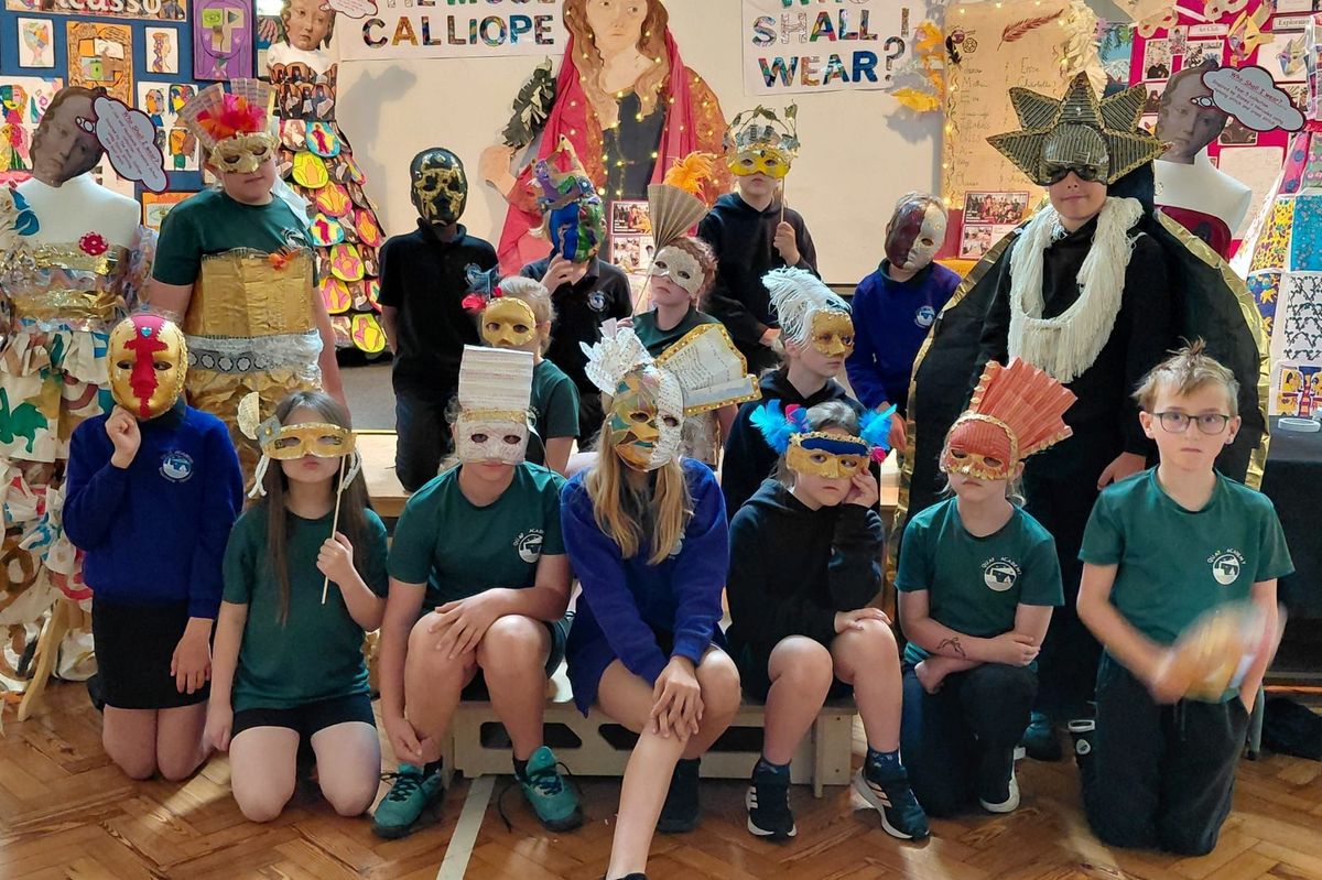 Children from Bridlington's Quay Academy display their masks