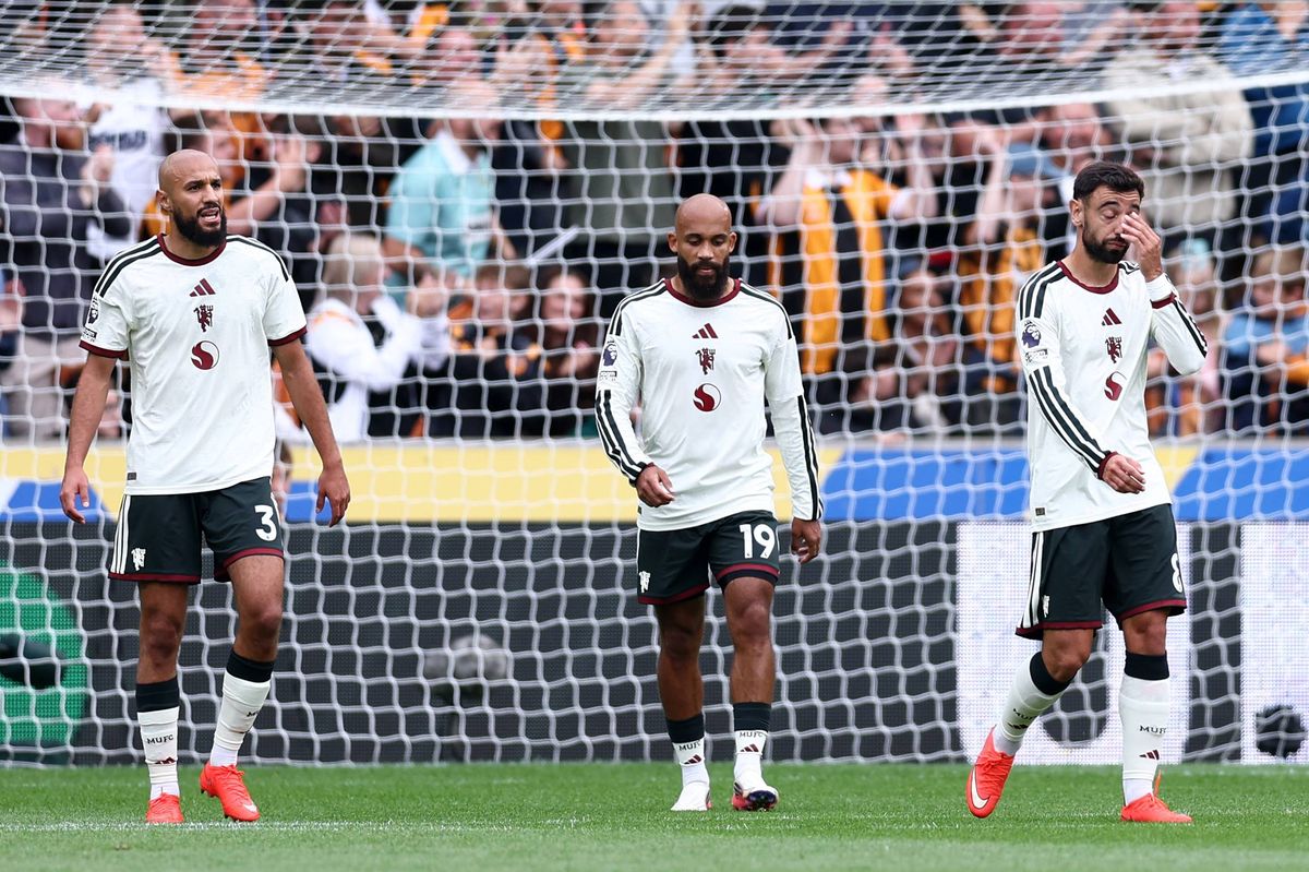 HULL, ENGLAND - AUGUST 22: (L-R) Noussair Mazraoui, Bryan Mbeumo and Bruno Fernandes of Manchester United react after their side concedes a goal during the Premier League 2026/27 match between Hull City and Manchester United at MKM Stadium on August 22, 2026 in Hull, England. (Photo by Molly Darlington/Getty Images)