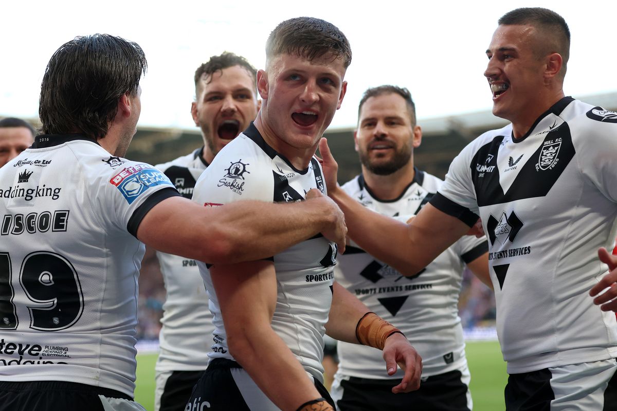Hull FC centre Davy Litten celebrates scoring a try.