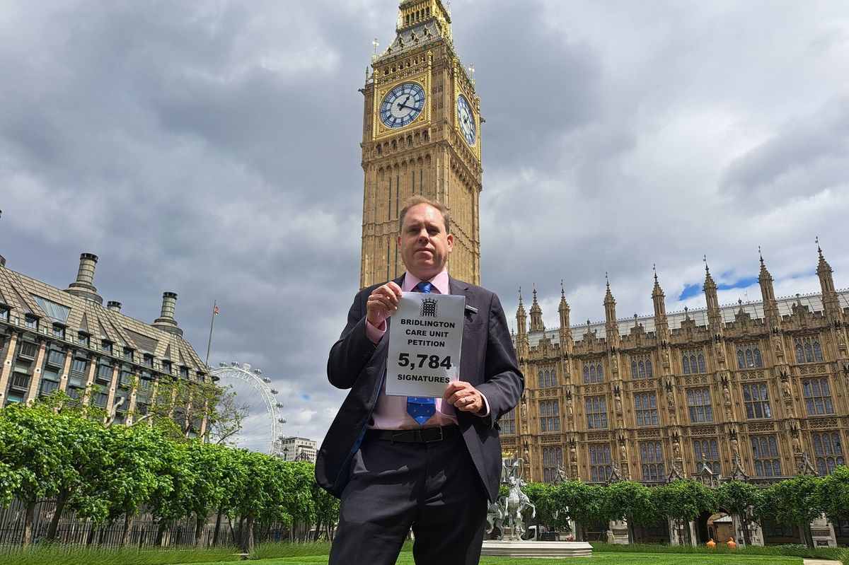 Charlie Dewhirst MP, pictured with his petition in central London, has campaigned for Bridlington Care Unit in Westminster