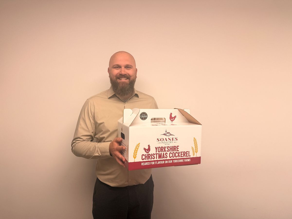 Soanes Poultry’s factory manager, Dmitrijus Solovjovas, with the Yorkshire Christmas Cockerel