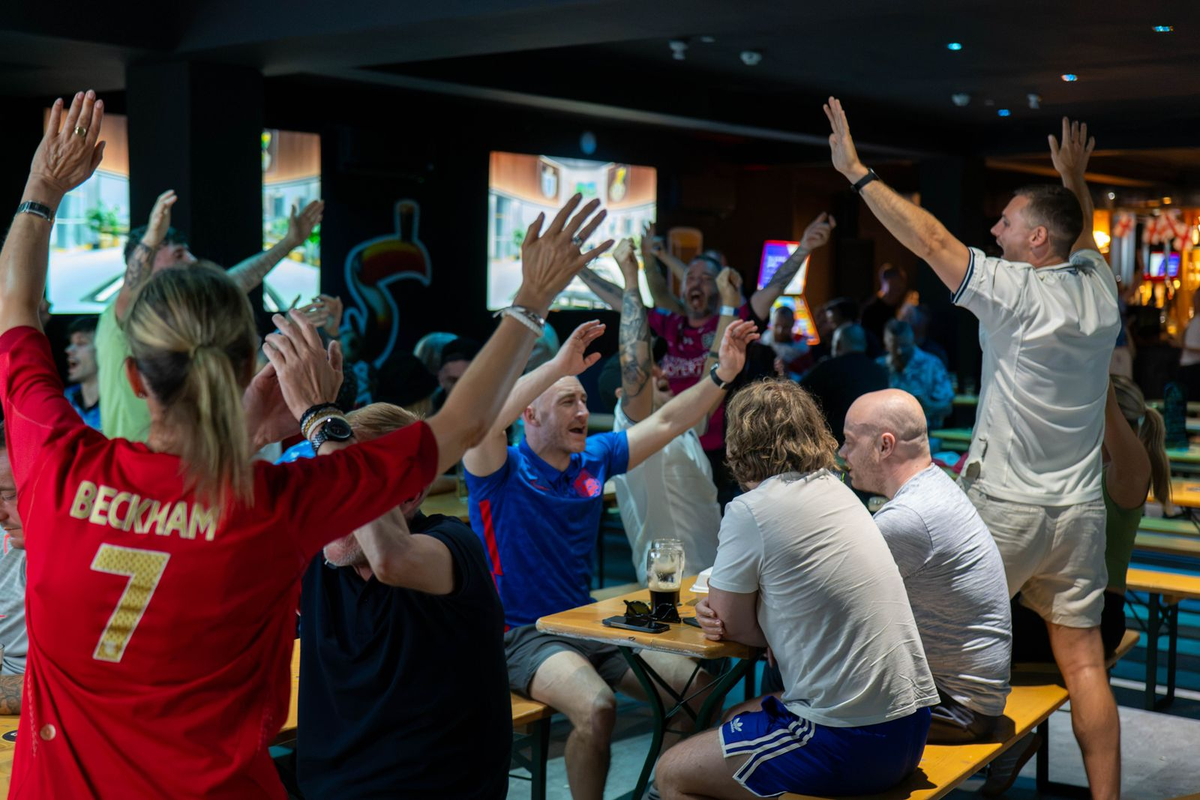Fans celebrate during one of the World Cup screenings at Molly Mangan’s