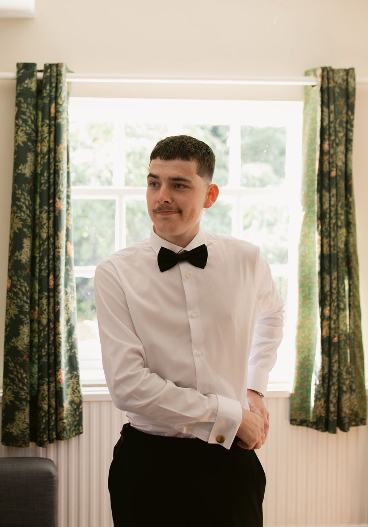 Tyler Cone in a suit with a bow tie
