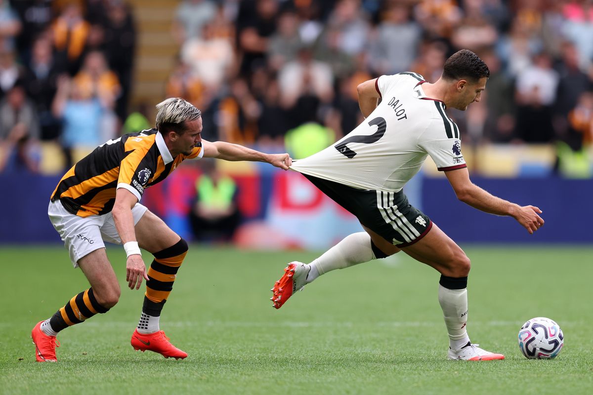 Liam Millar battles Diogo Dalot against Manchester United