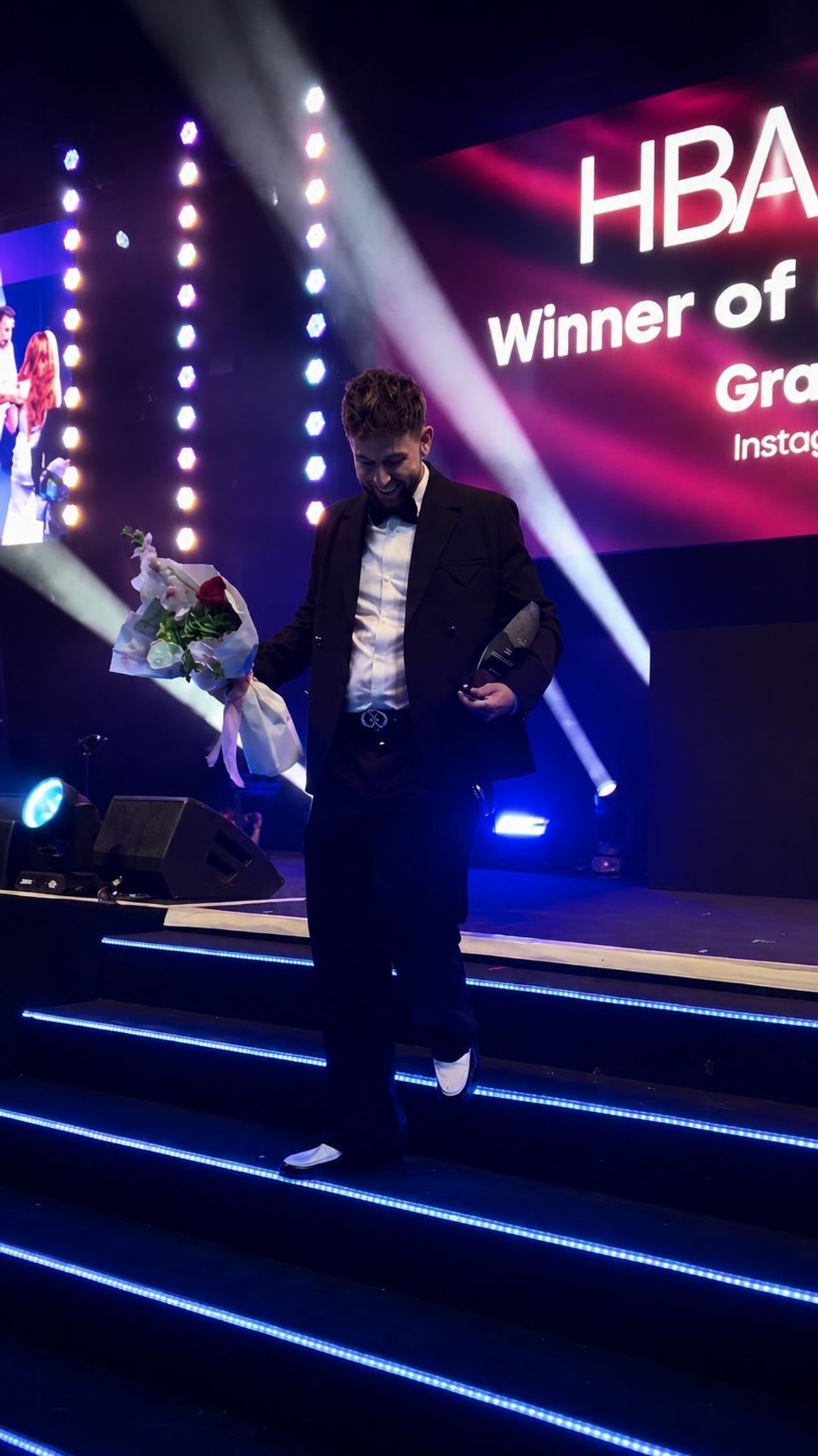 Grant Percival walks off stage clutching the coveted HBA rising star award
