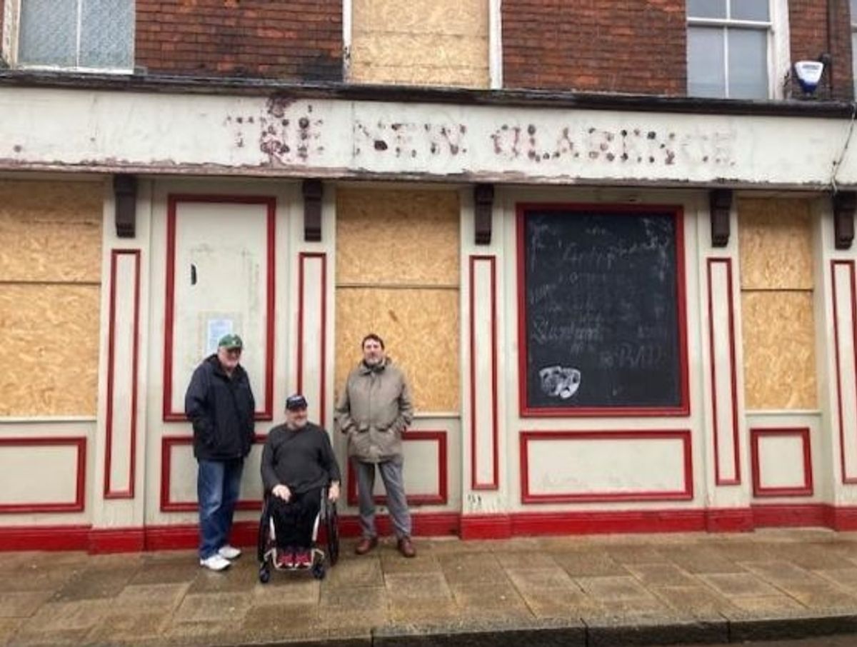 The boarded-up pub in 2023, when three regulars stood outside and decided to fight for it