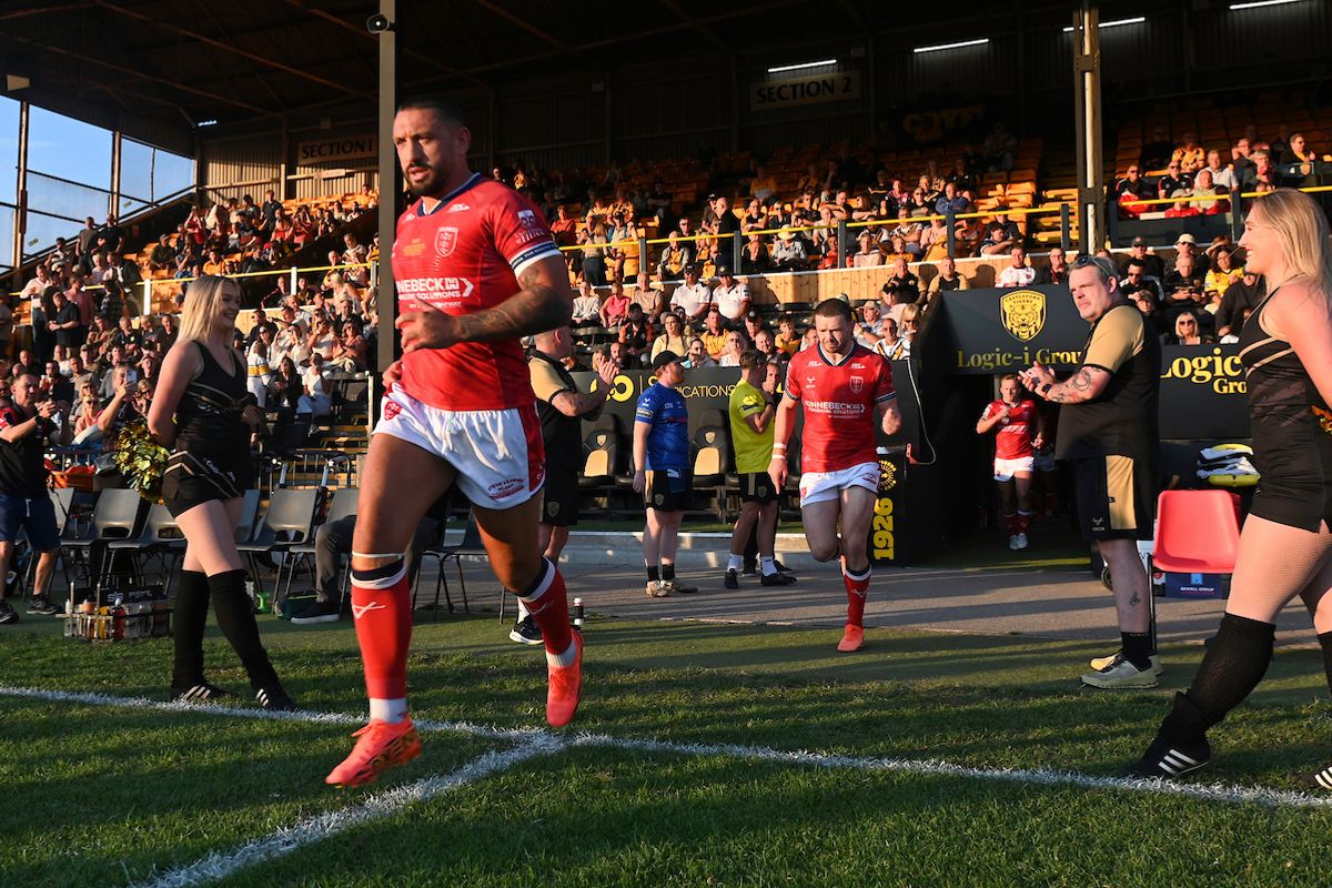 Hull KR's Elliot Minchella leads his side out to the field of play against Castleford.