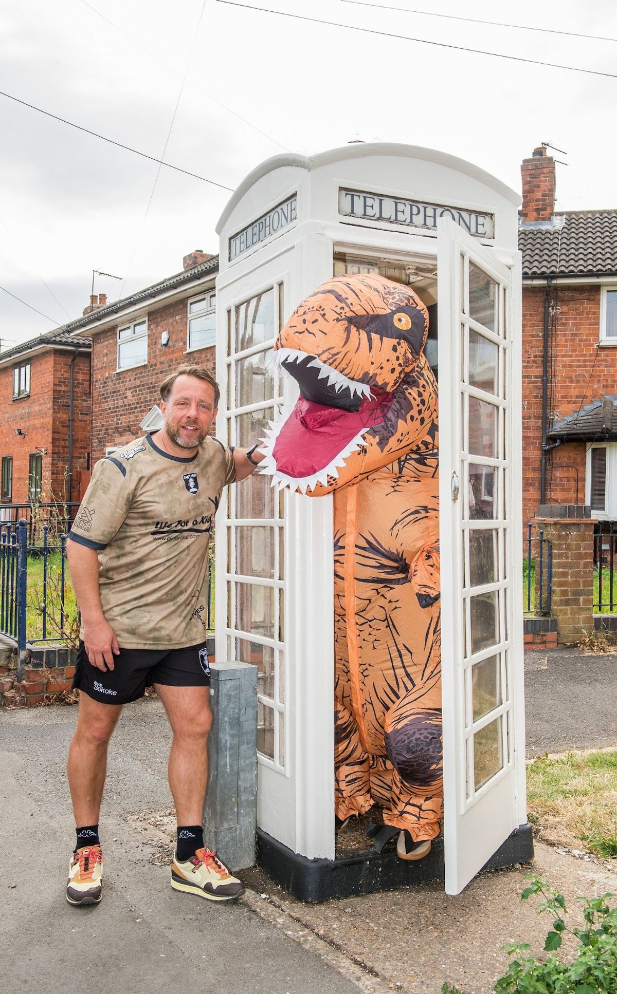 Dean Hoggard and a prehistoric pal at the cream kiosk unveiling