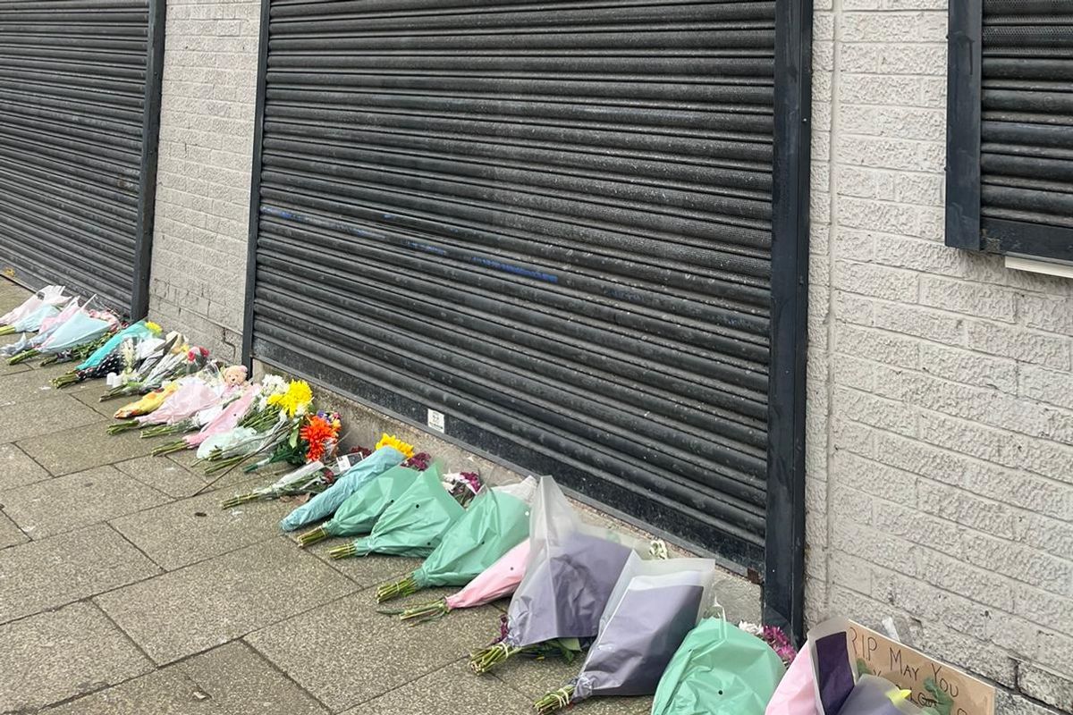 Flowers laid in tribute outside a shuttered Legacy Funeral Directors in Hessle Road, Hull