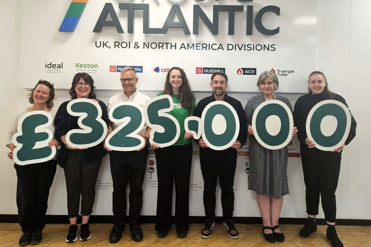 Staff celebrate the fundraising milestone
