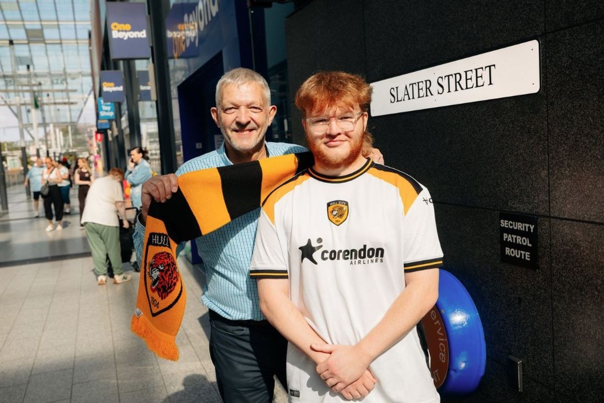 Jim Harris, left, centre manager at St Stephen’s with Finley Freeman, from Tiger Leisure at St Stephen’s, and the new signage
