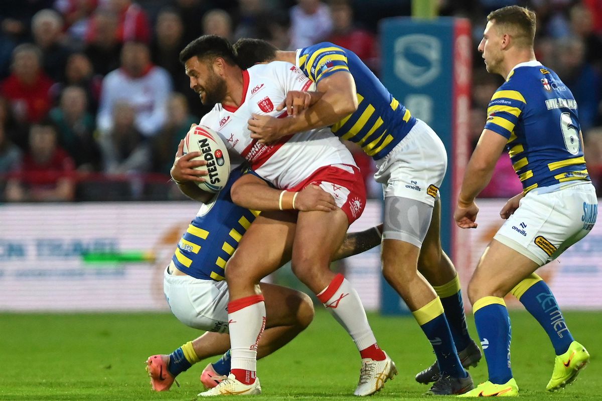 Hull KR's Rhyse Martin is tackled by Warrington.